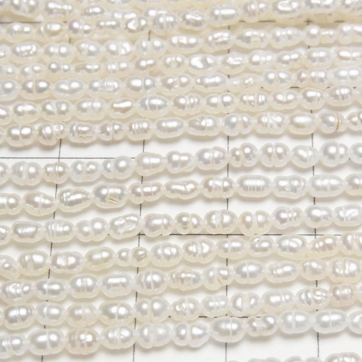 Fresh Water Pearl AA Bands with Rice 4x3x3mm White 1strand beads (approx. 14inch/34cm)