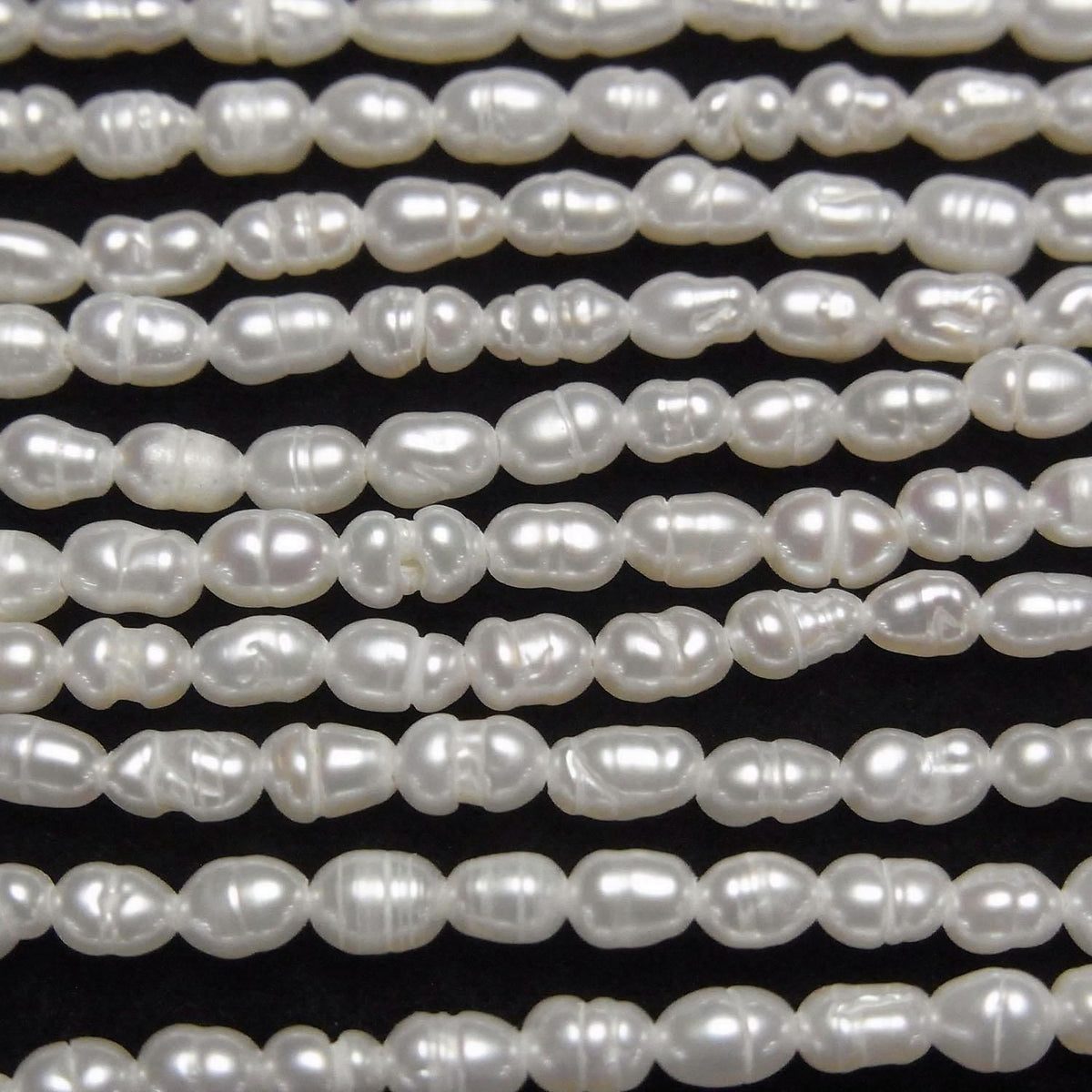 Fresh Water Pearl AA Bands with Rice 4x3x3mm White 1strand beads (approx. 14inch/34cm)