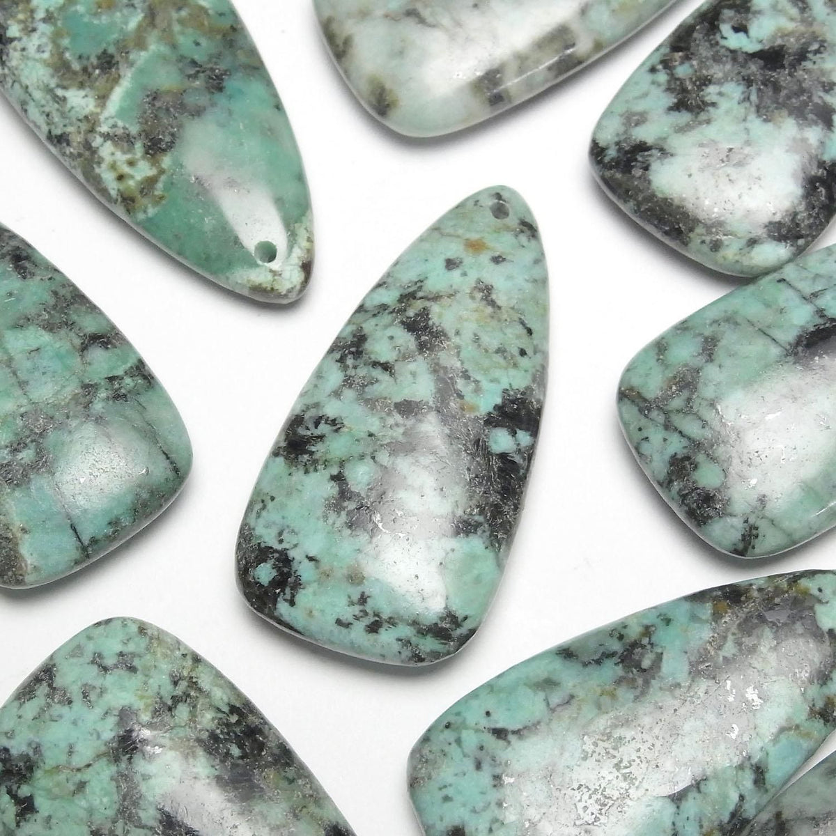 African Turquoise deformed pear shape 40x20mm 1pc