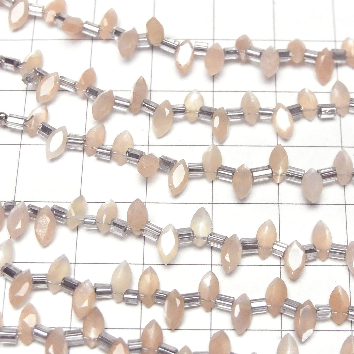 高品質桃月光石AA++ 馬眼形刻面 6x3毫米 1串珠子 (18顆)
