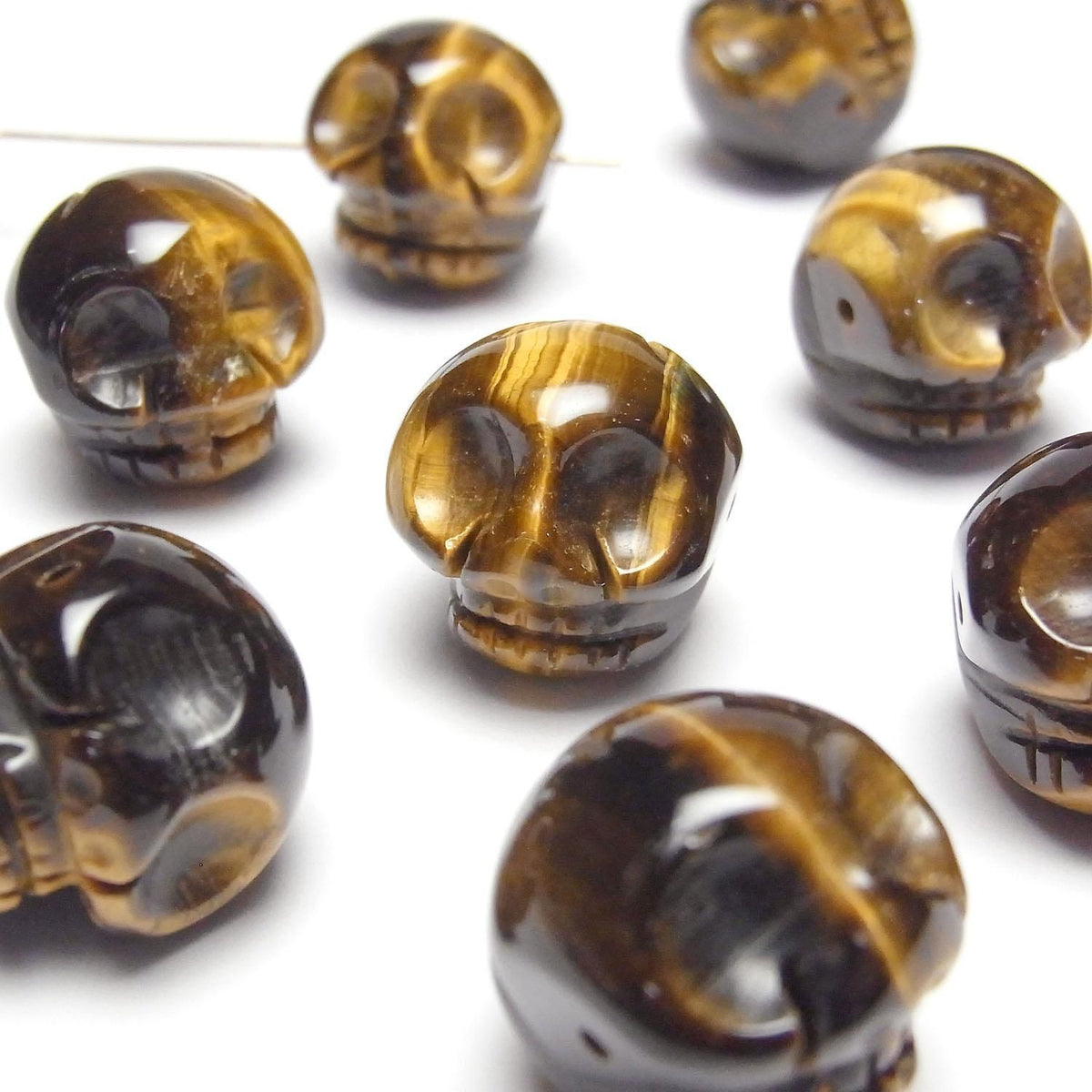 Yellow Tiger's Eye AAA- Skull with 20mm side hole 1 piece