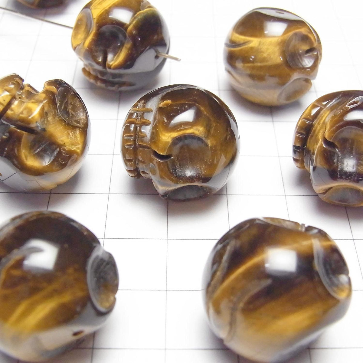 Yellow Tiger's Eye AAA- Skull with 20mm side hole 1 piece