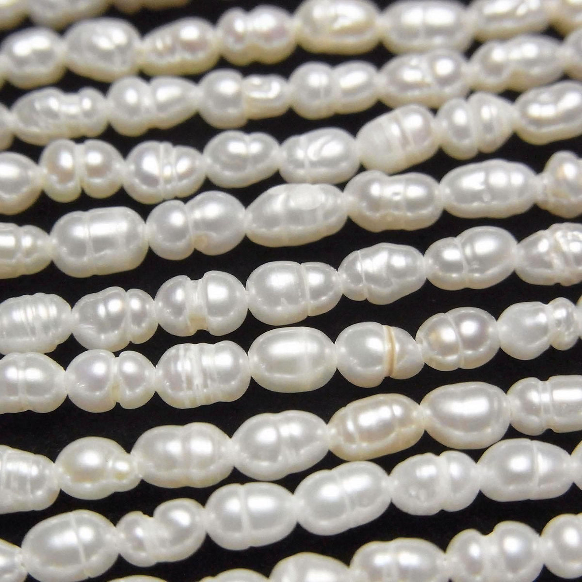 Fresh Water Pearl AA Bands with Rice 4x3x3mm White 1strand beads (approx. 14inch/34cm)