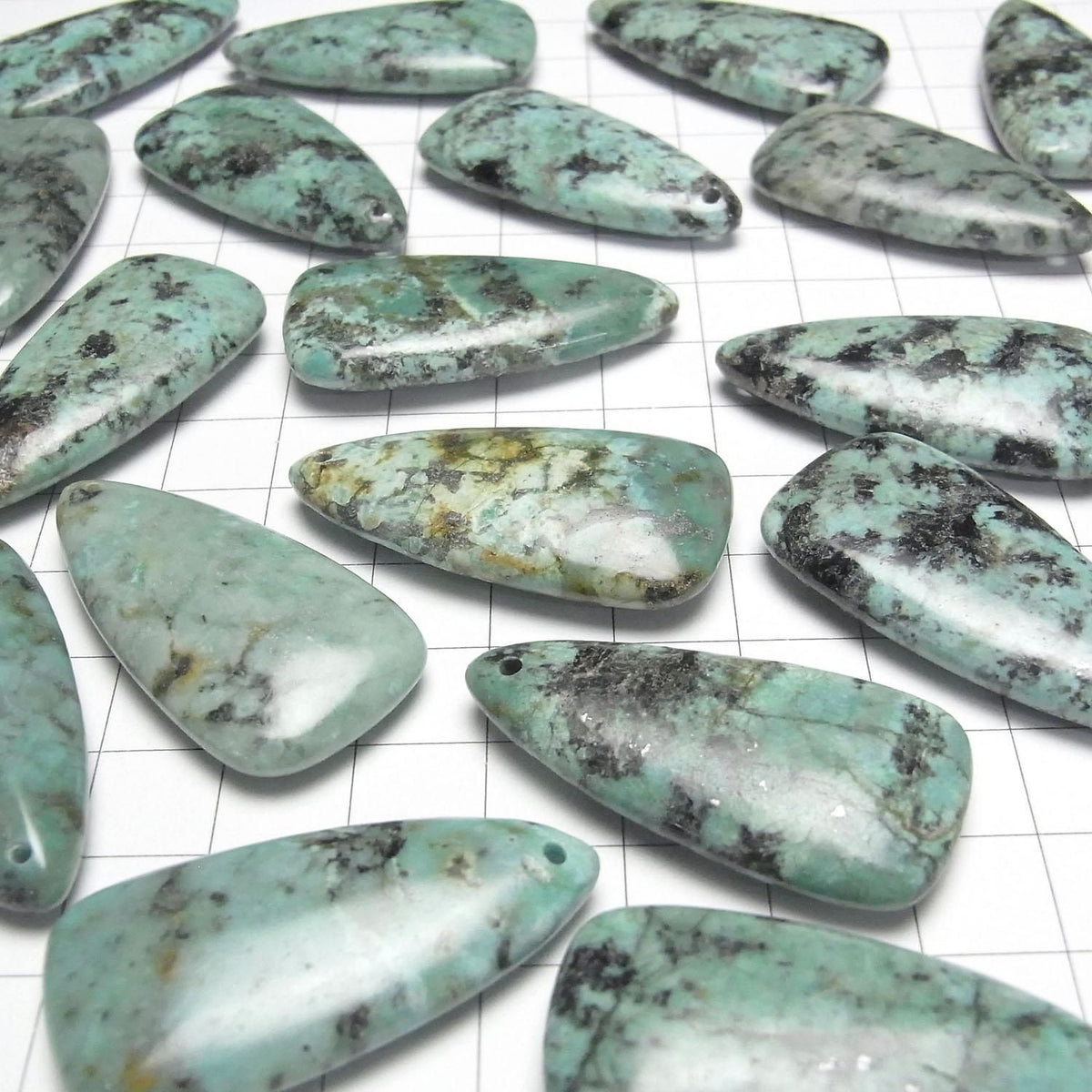 African Turquoise deformed pear shape 40x20mm 1pc
