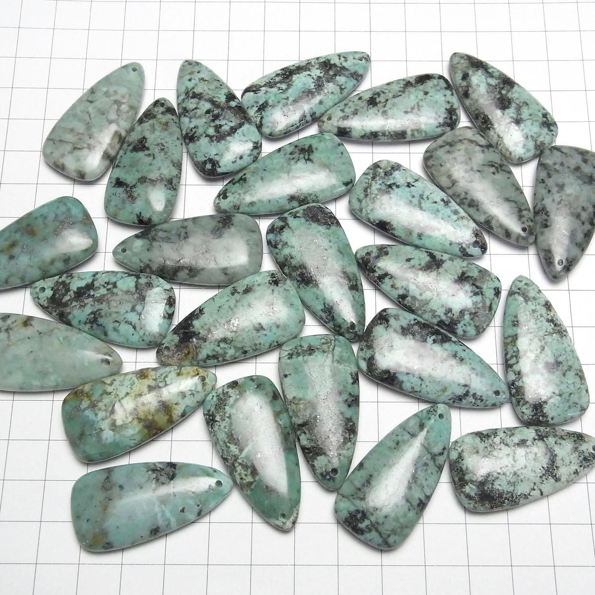 African Turquoise deformed pear shape 40x20mm 1pc