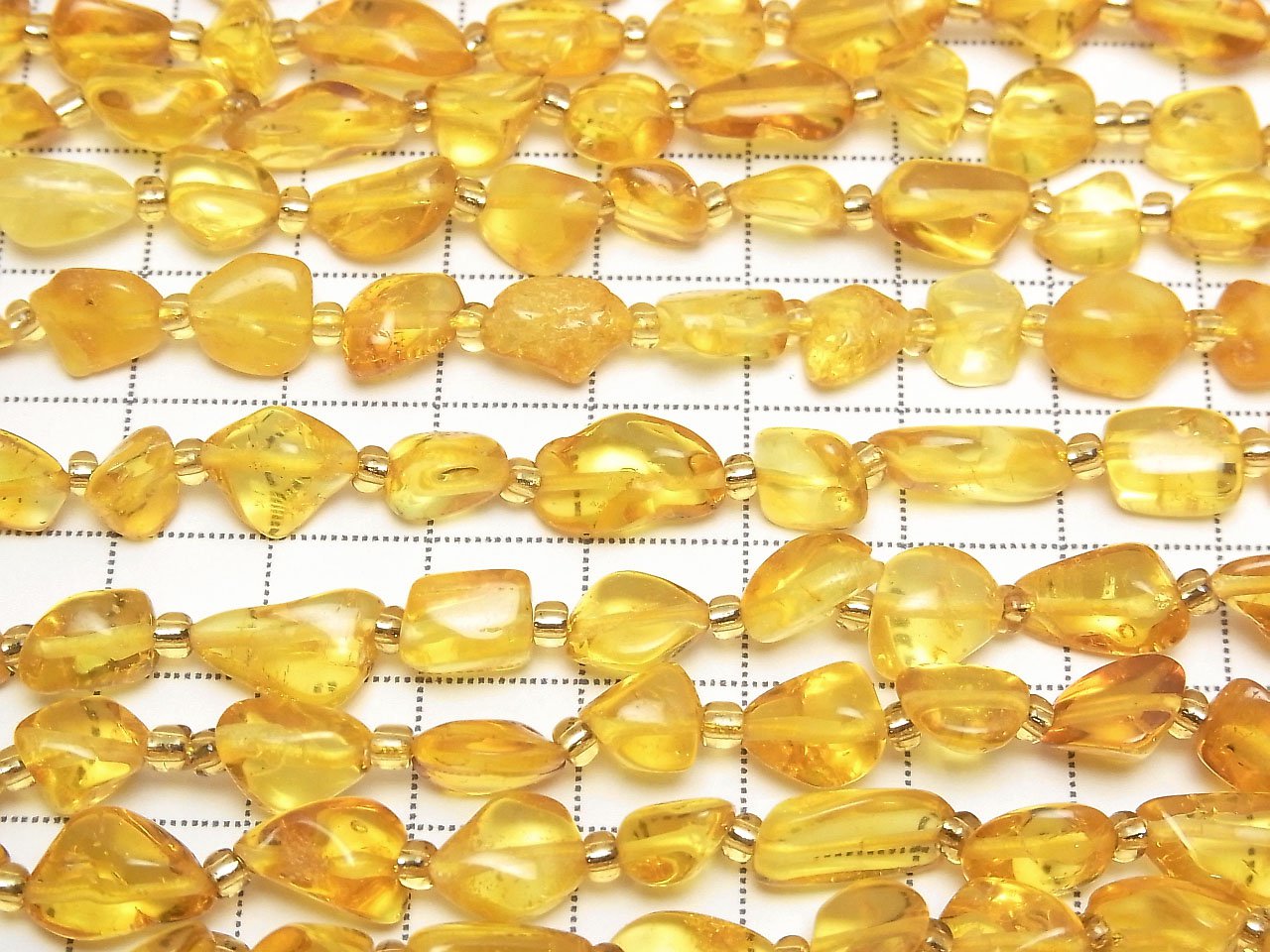 Perles en ambre de la Baltique (tube-pépite), 1 fil (environ 32 cm)