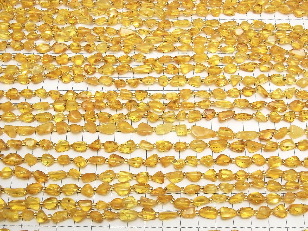 Perles en ambre de la Baltique (tube-pépite), 1 fil (environ 32 cm)