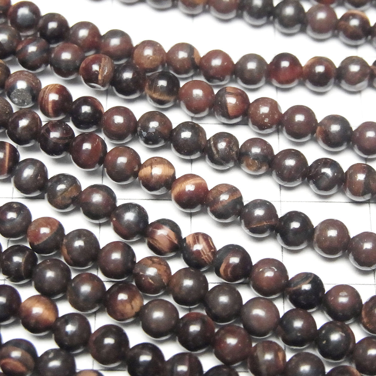 Perles rondes Œil de Tigre en Fer 4mm 1 fil (env. 38cm)