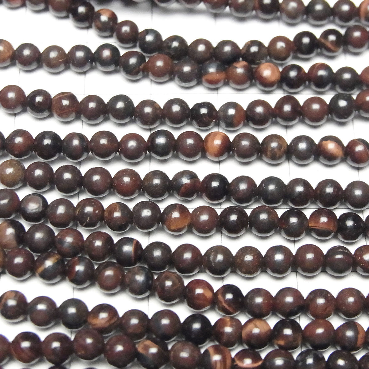 Perles rondes Œil de Tigre en Fer 4mm 1 fil (env. 38cm)