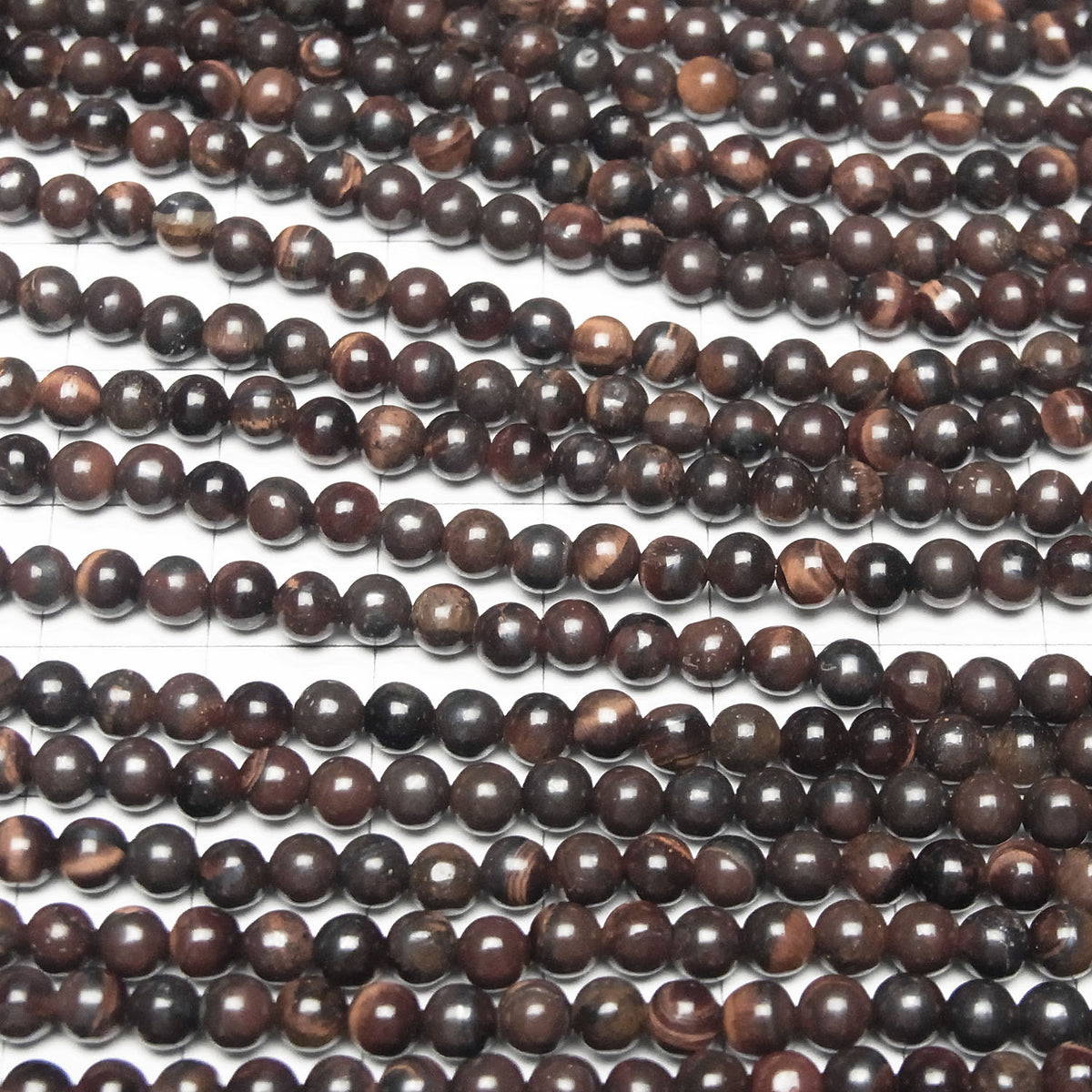 Perles rondes Œil de Tigre en Fer 4mm 1 fil (env. 38cm)