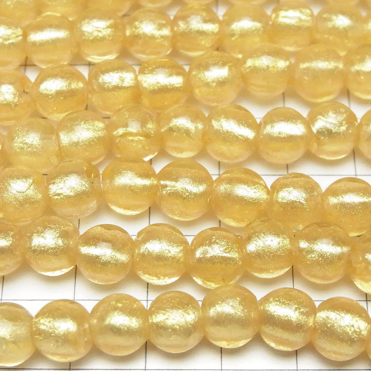 Perles en verre filé rondes 8mm [Poudre d'or x Transparent] 1 fil (env. 25cm)