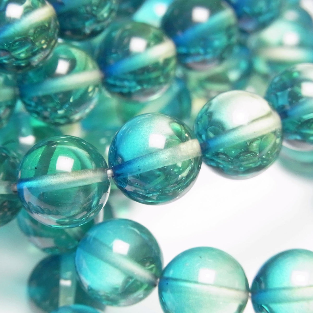 Perles rondes de 10 mm de couleur ambre bleu-vert 1 fil (bracelet)