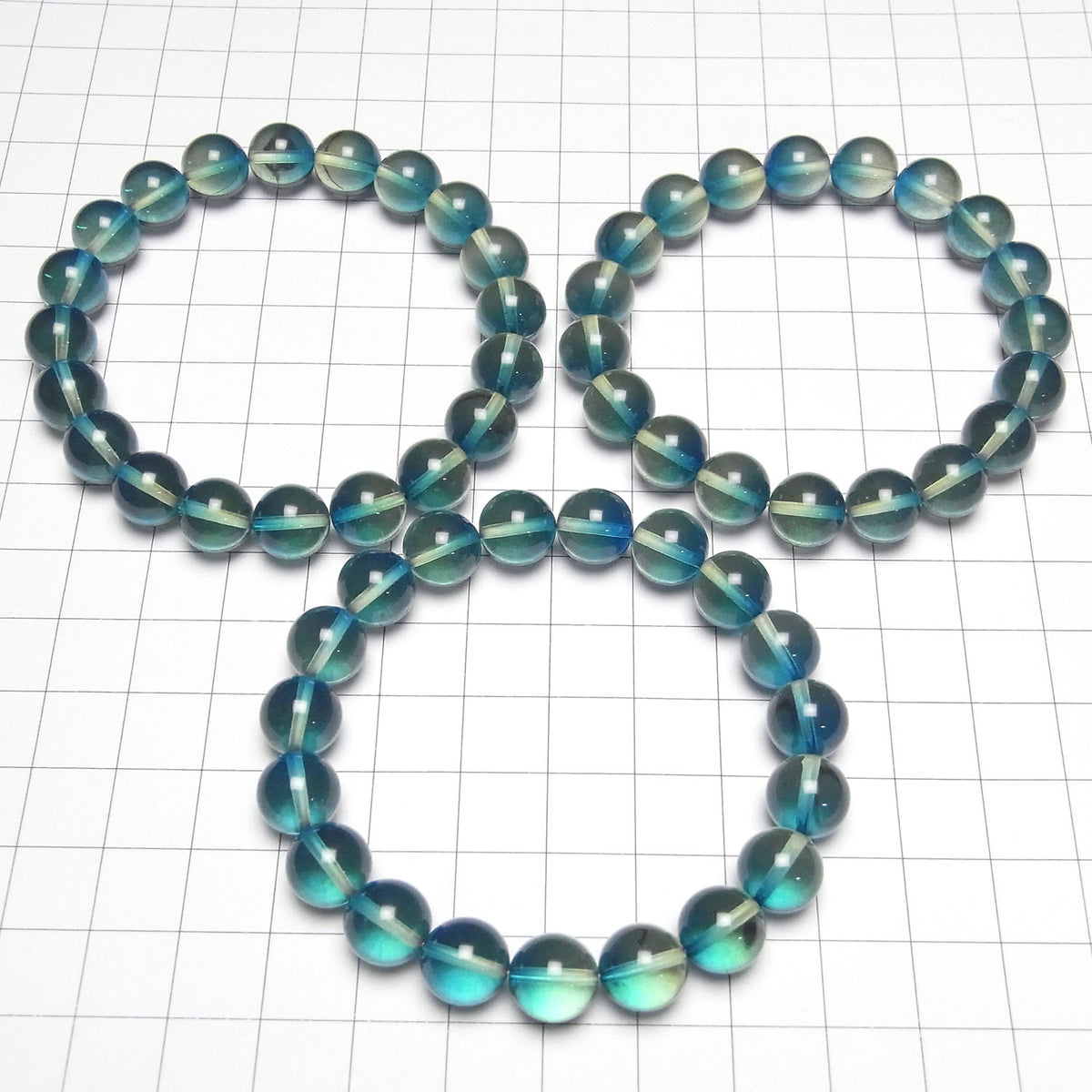 Perles rondes de 10 mm de couleur ambre bleu-vert 1 fil (bracelet)